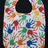 Primary Color Handprint Wipeable Bib